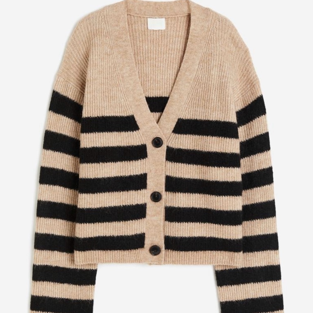 Sold out, oversized, rib knit cardigan in soft fabric with wool content.